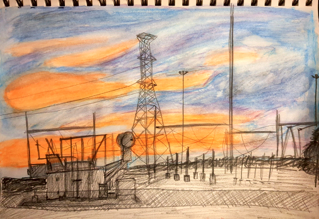 deep orange and blue clouds at sunset behind the silhouette of a power substation.
