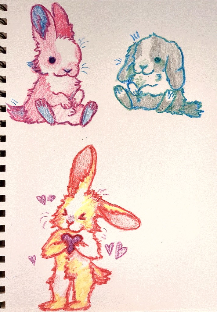 three chibi bunnies of various colours and patterns