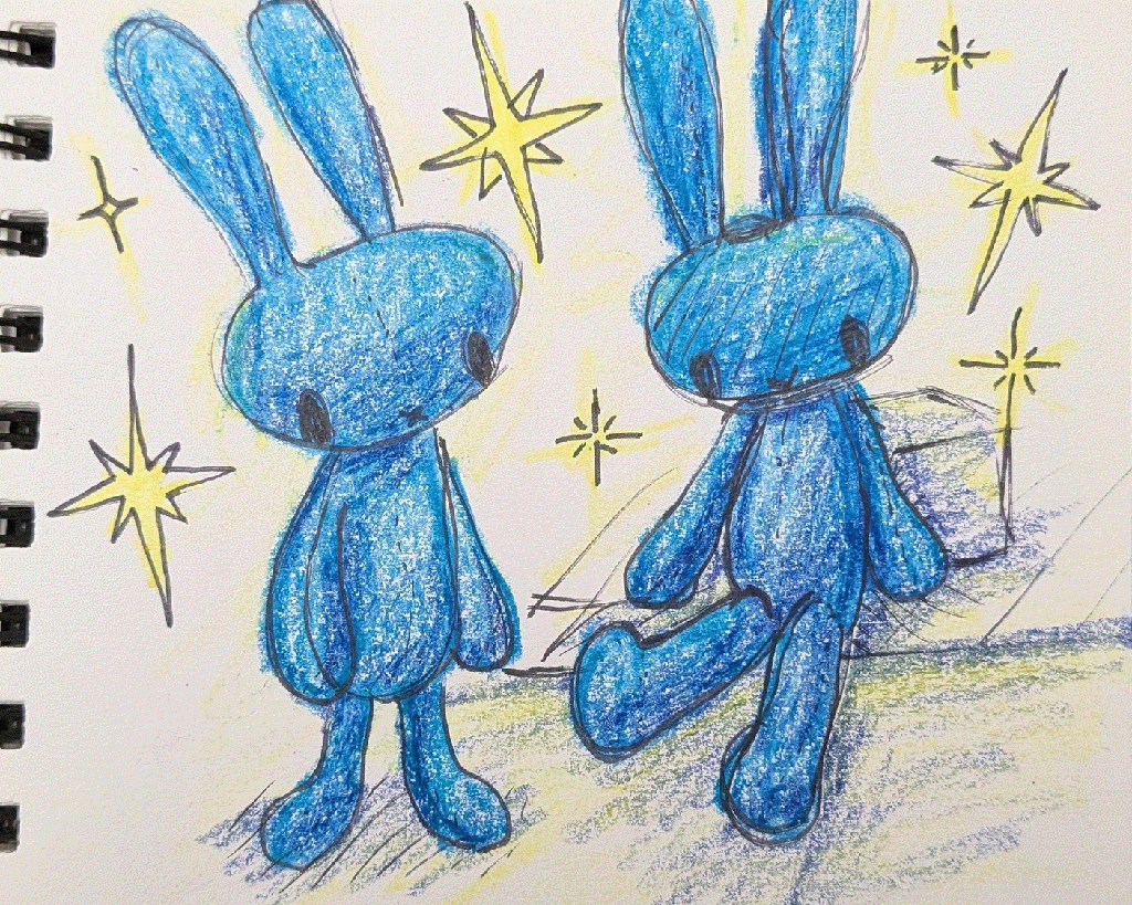 blue rabbit plushie surrounded by sparkles